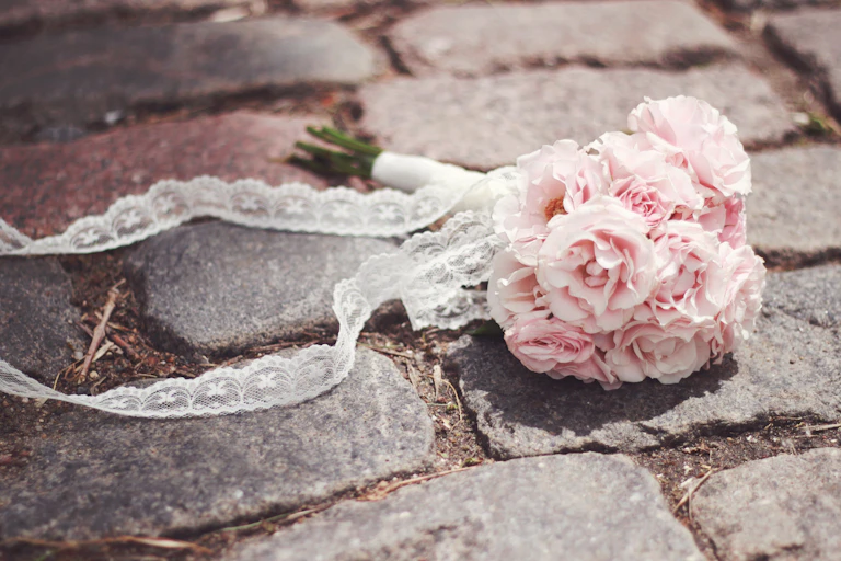 A bridal bouquet on cobblestones