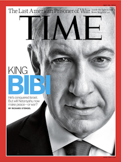 A Time Magazine cover with a photo of a man's face, and a headline saying