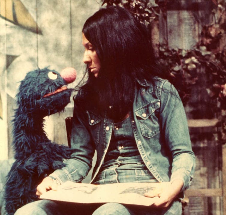 Buffy looks down at Grover.