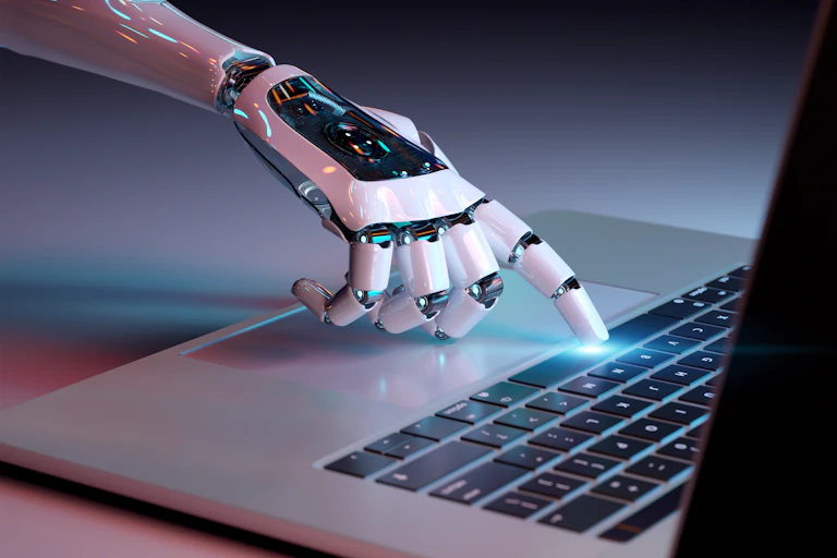 Robotic hand tapping on a keyboard