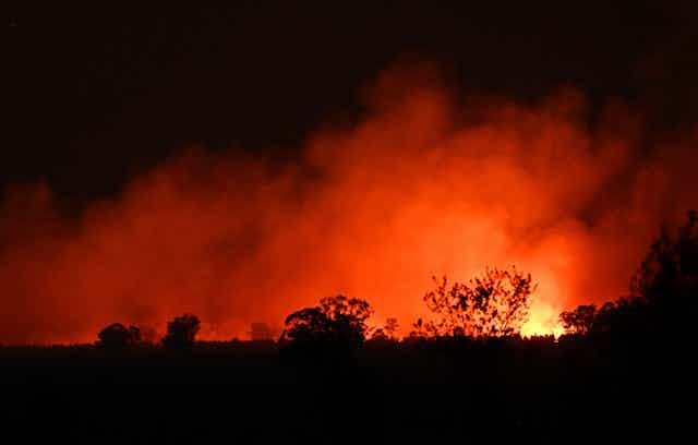 nighttime fires in Queensland. Night sky, burning trees
