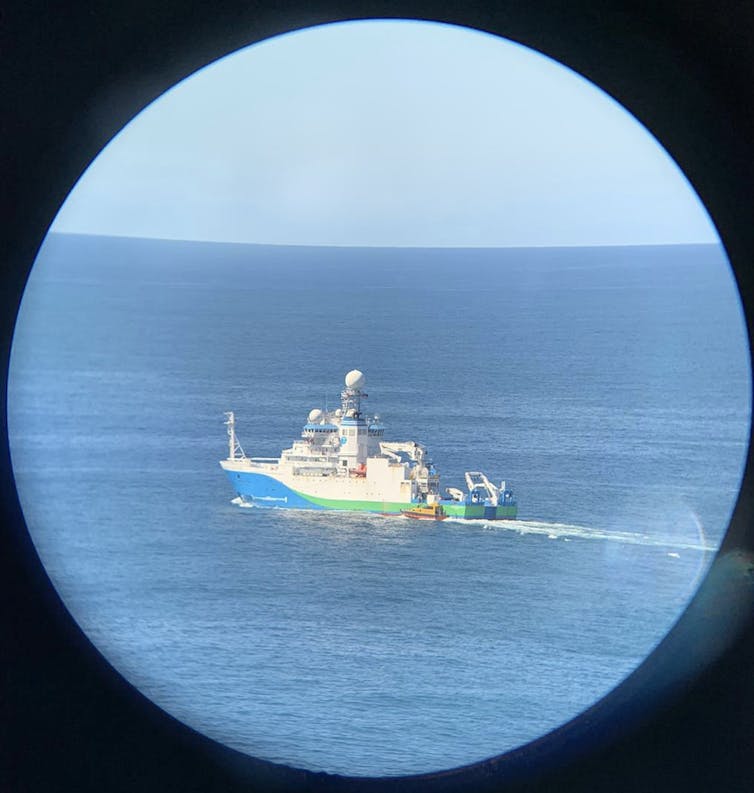 marine research boat seen through binoculars