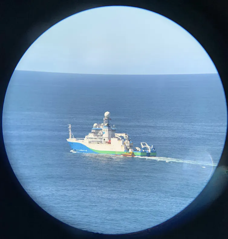 marine research boat seen through binoculars