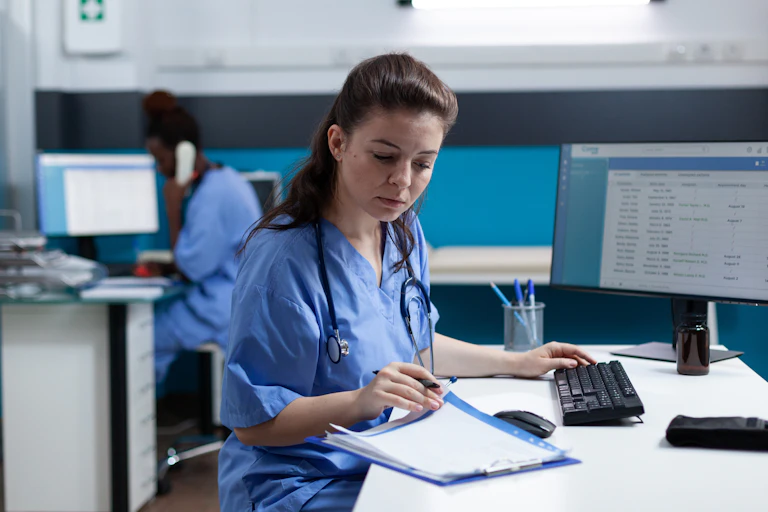 Nurse looks at treatment plan