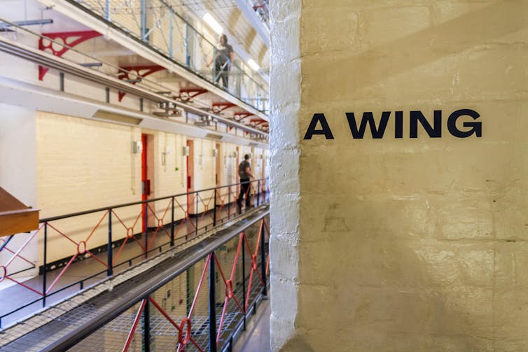An interior shot of a Victorian era prison.