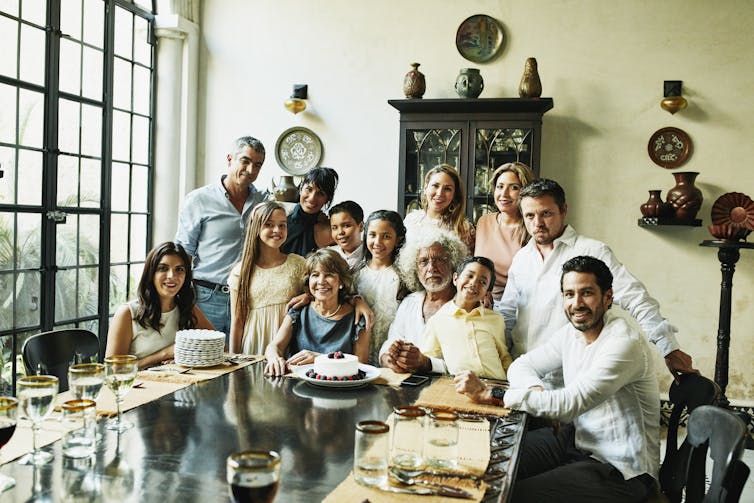 portrait of a multigenerational family at a dining table