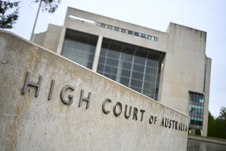 A close-up of the concrete 'High Court of Australia' sign
