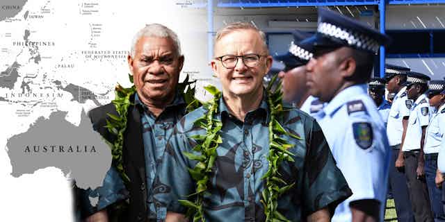 Australian Prime Minister Anthony Albanese with Vanuatu Prime Minister Bob Loughman in front of a map of the Pacific and Fijian police.