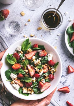 Strawberry and leaf salad in a bowl