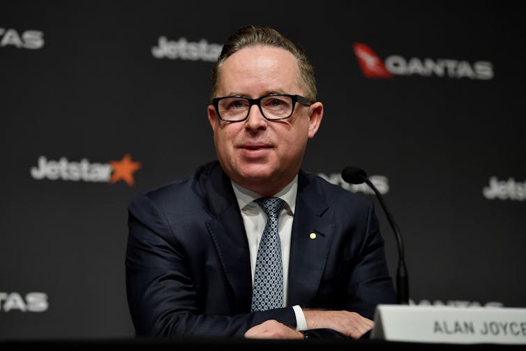 Former Qantas CEO Alan Joyce speaks to media during a press conference.