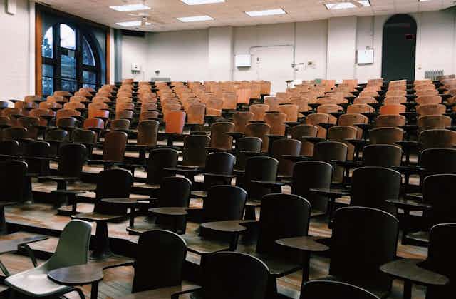 Rows of chairs in an empty lecture hall