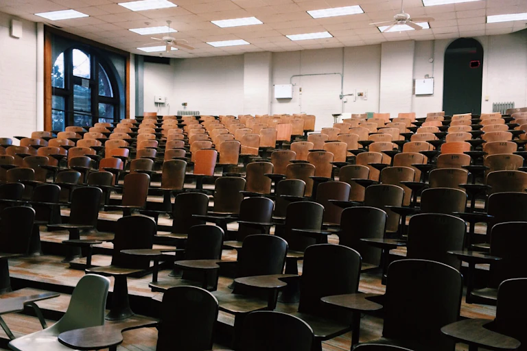Rows of chairs in an empty lecture hall