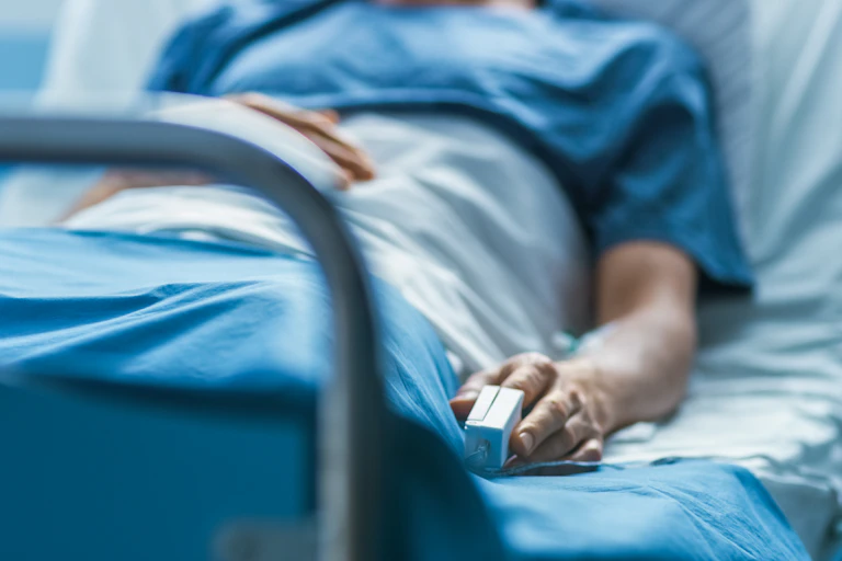 A person in a hospital bed