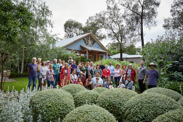 A group photo of families involved in a building group constructing new homes in Eltham