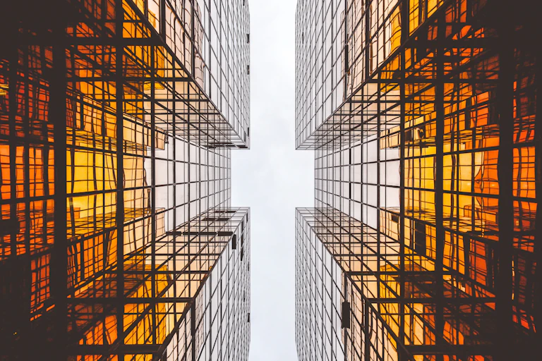 Abstract view of two mirrored skyscrapers viewed from the ground looking up