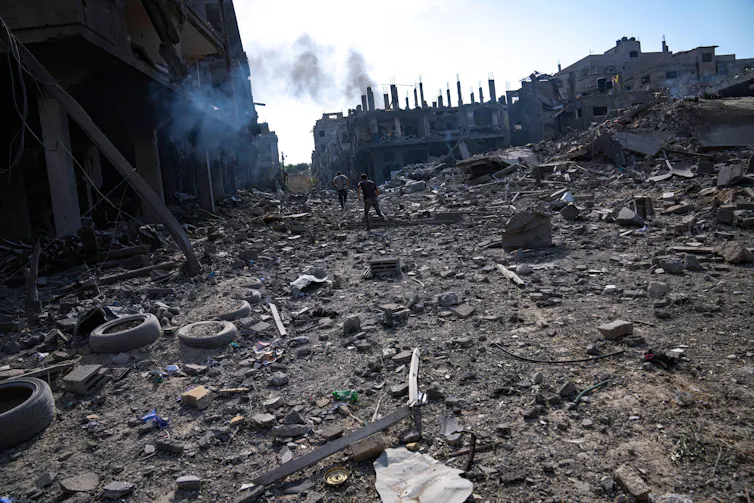 Massive damage following bombing in Gaza City, buildings are completely destroyed.