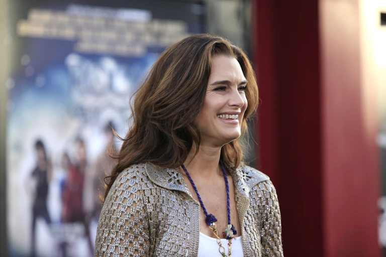 Actress Brooke Shield smiles for cameras on the red carpet.