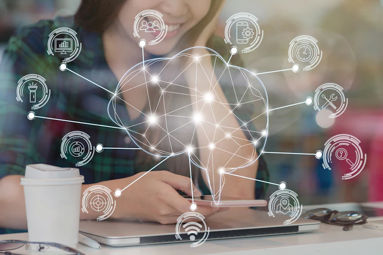 A casually dressed woman looks down at her phone, from which an icon of a brain emerges, surrounded by smaller icons denoting various tasks and places