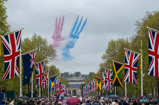 Red Arrows fly over The Mall for the Coronation of King Charles III, London, UK