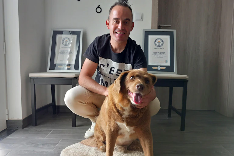 Man holding a dog.