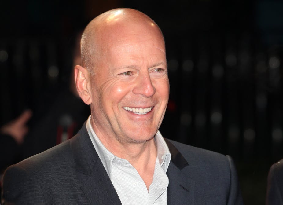 Actor Bruce Willis smiles for a picture.
