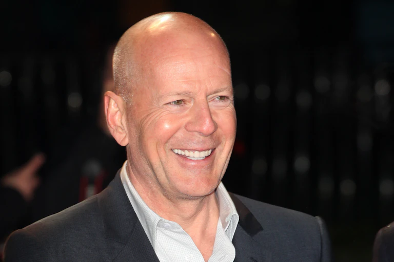 Actor Bruce Willis smiles for a picture.
