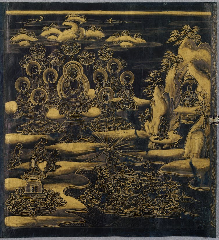 A scroll with golden etching on a black background depicting a scene from the life of the Buddha.