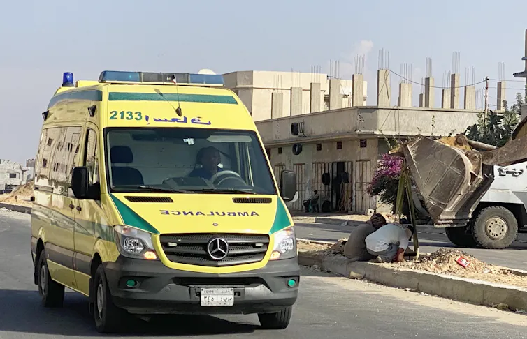 A Egyptian ambulance evacuates a Palestinian from Gaza through the Rafah crossing.