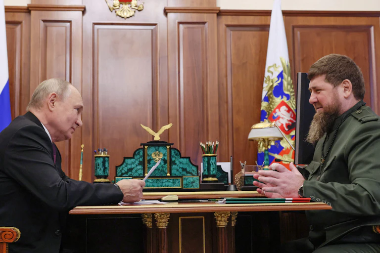 Vladimir Putin and Ramzan Kadyrov sit across from each other