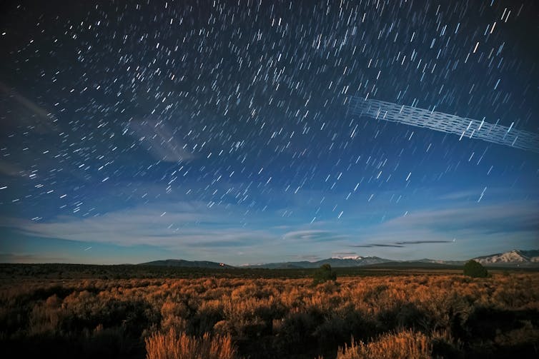 photo of a night sky with blurred dots of light