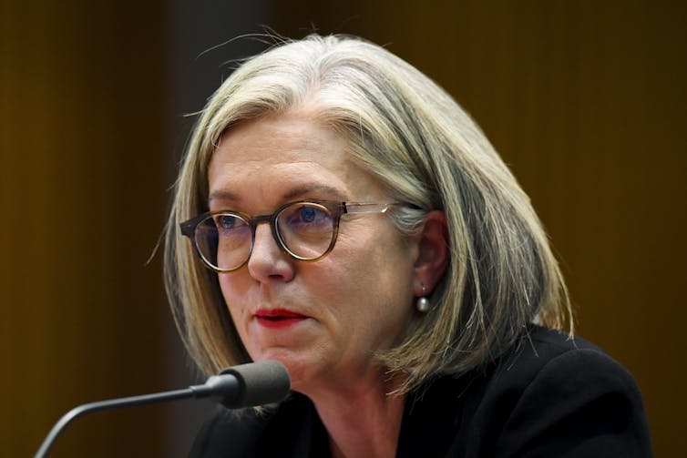 Deputy Chair of the Australian Securities and Investments Commission Karen Chester speaks before a Parliamentary inquiry in 2021.