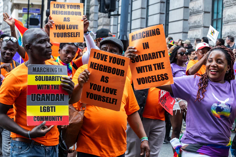 People demonstrate holding signs