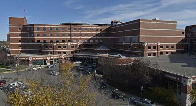 A large brown hospital building.