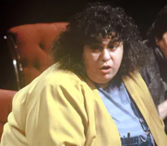 A head shot of Dworkin wearing a yellow jacket.