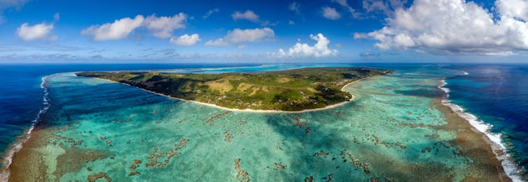 Aitutaki island lagoon and sea and island