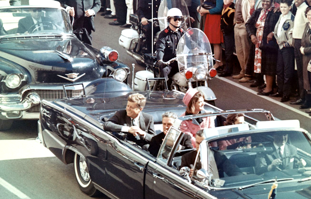 John F. Kennedy  and Jackie Kennedy in a limousine
