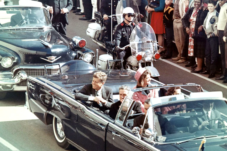 John F. Kennedy and Jackie Kennedy in a limousine