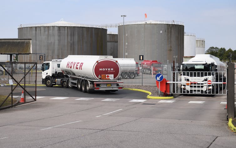 White oil tankers leaving and departing an oil terminal.