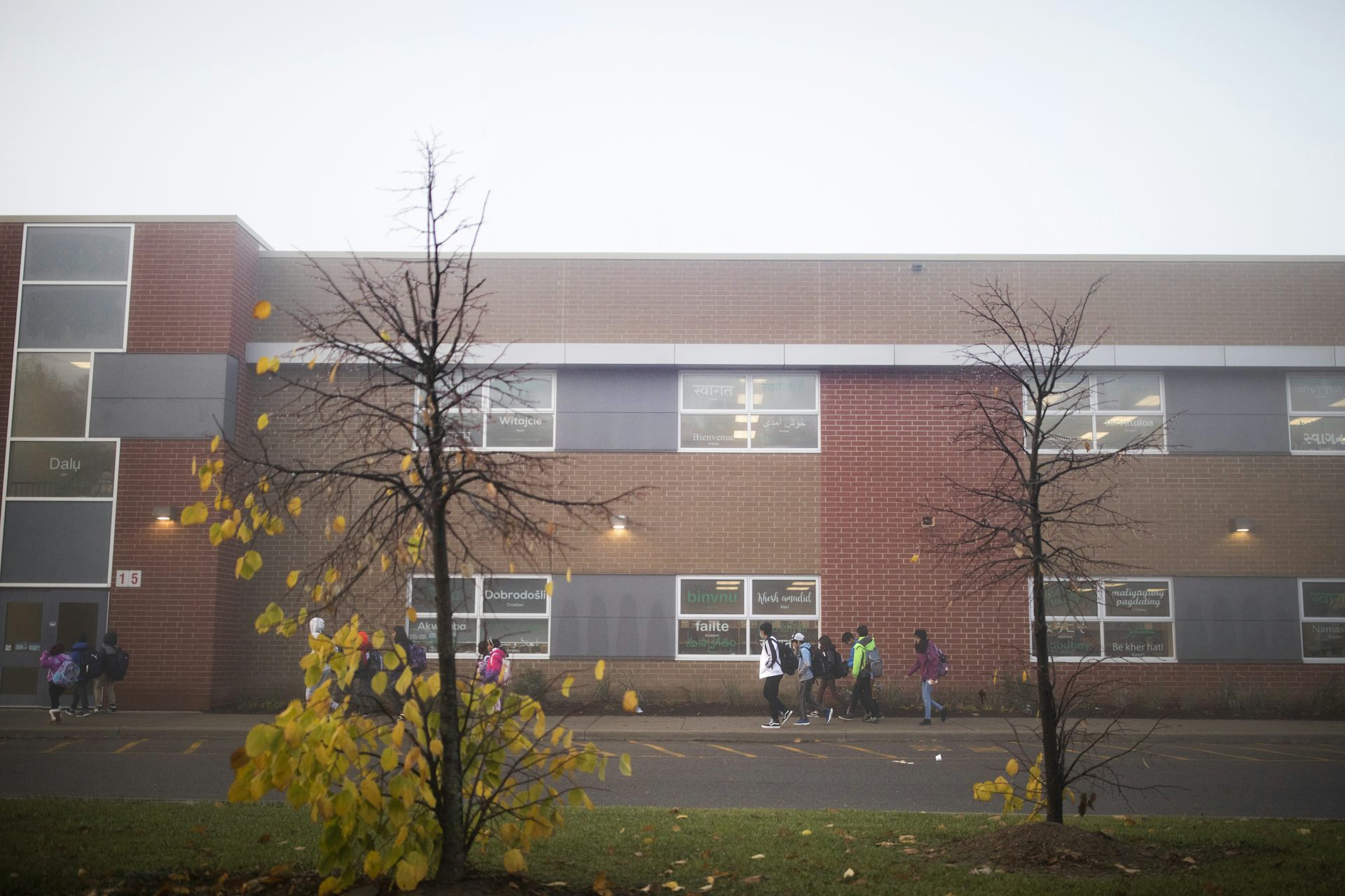 Children seen walking outside a school.