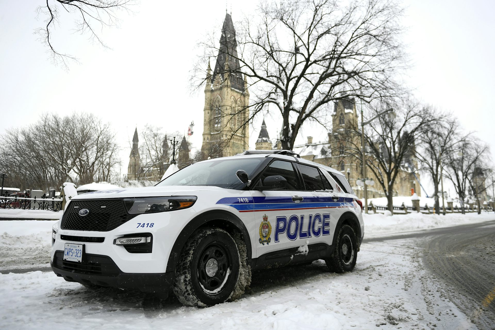 An Ottawa police cruiser with the Parliament buildings in the background.