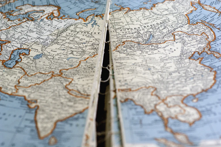 An old map of Soviet Russia is seen with a split down the center.