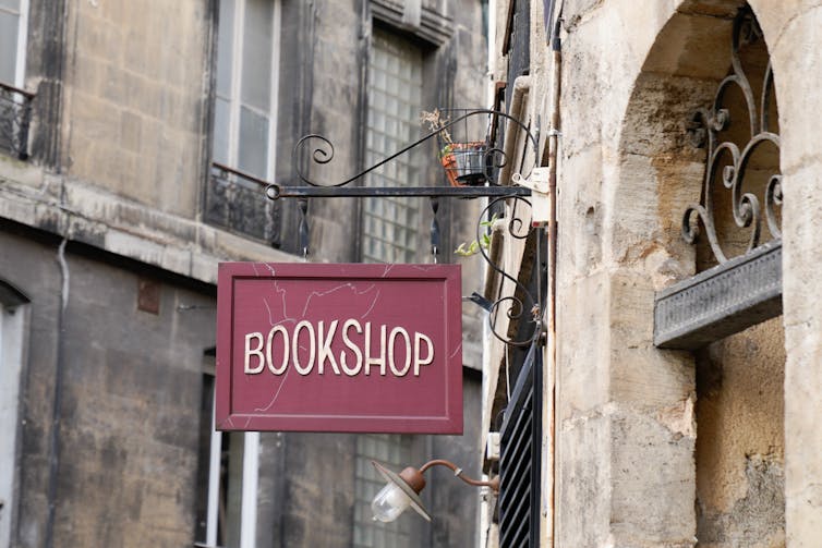 A photograph of an old fashioned bookshop sign