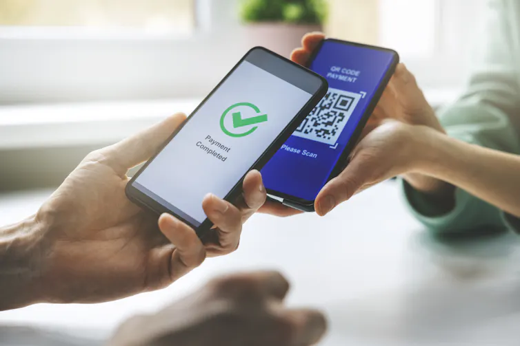 Unidentified person making payment using iPhone