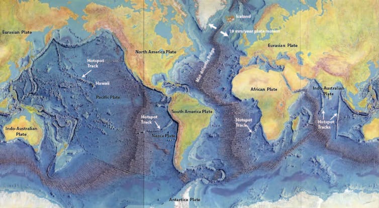 A map shows  details of midocean ridges looking like seams on a baseball as they wind through the major oceans.