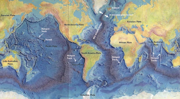 A map shows details of midocean ridges looking like seams on a baseball as they wind through the major oceans.