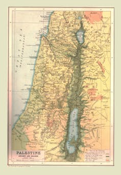 An old map shows a land mass next to a sea.