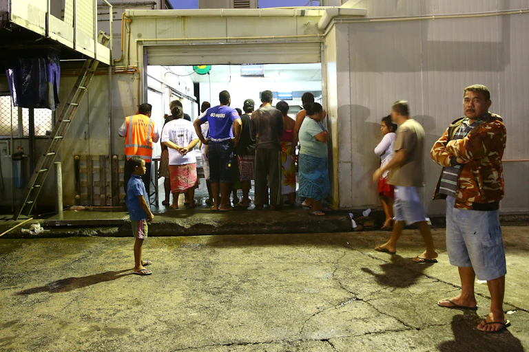 Samoan people at a market early morning