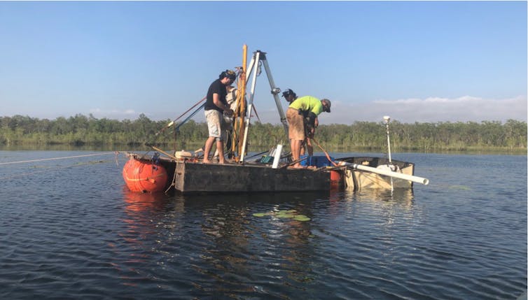 Two men drilling for scientific samples