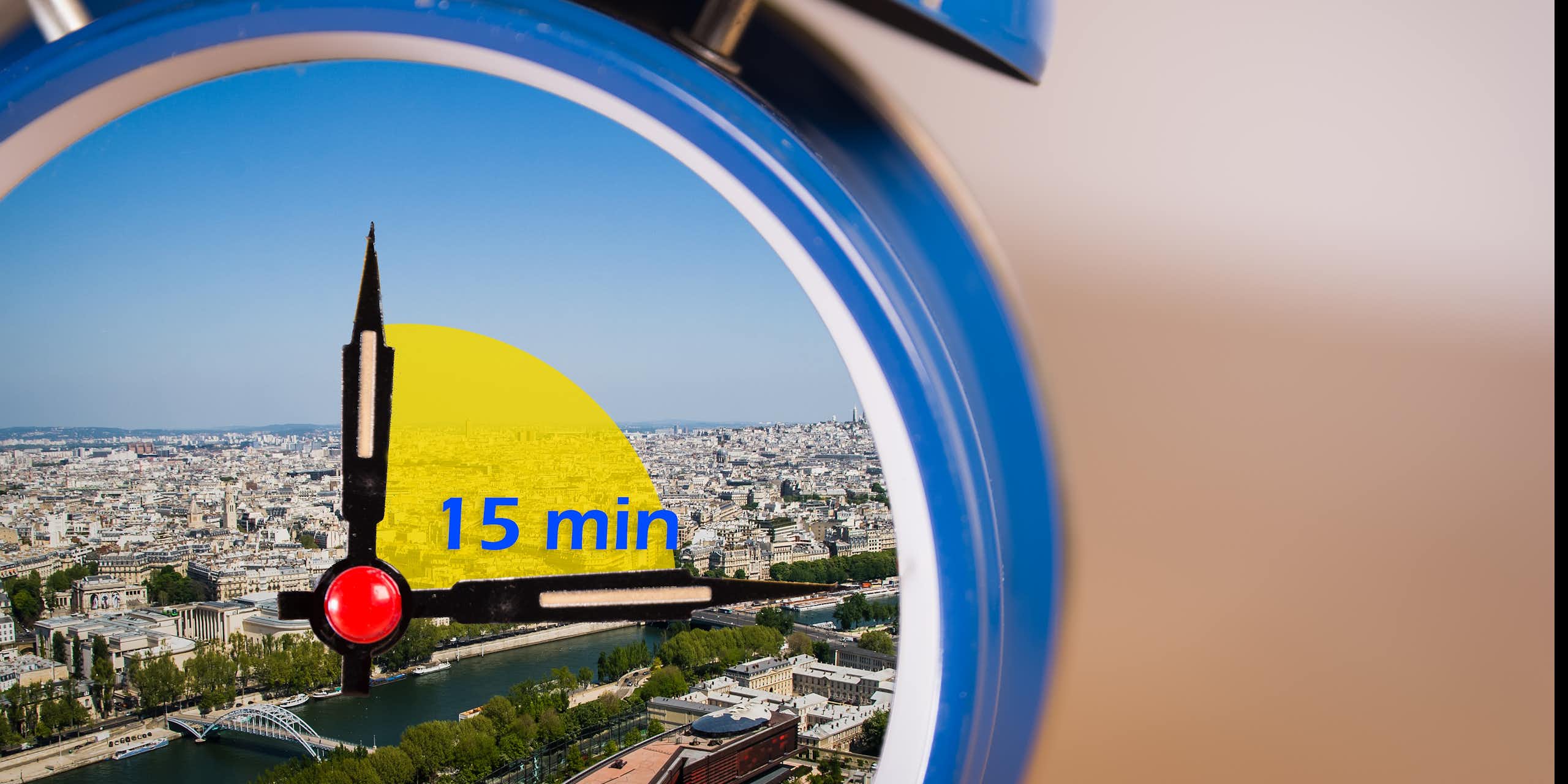 an alarm clock with a 15-minute timer and the background of a city