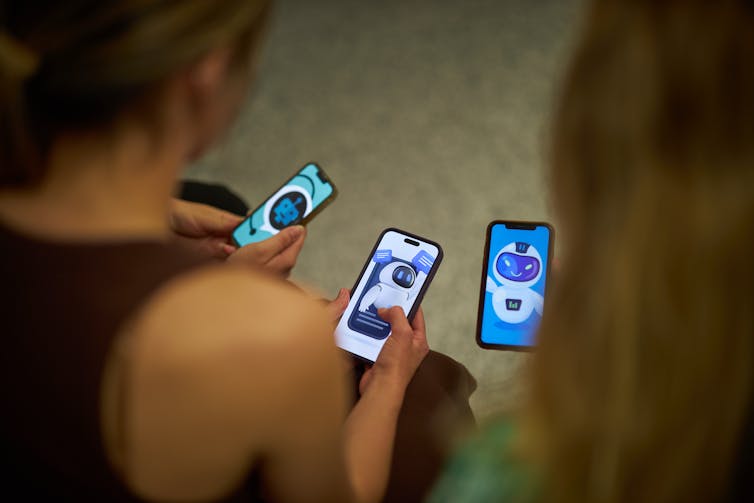 Young people look at chatbots on their phones.